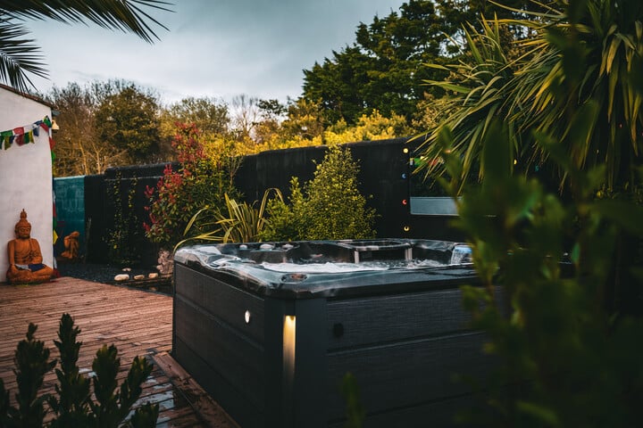 backyard hot tub ideas - plants surrounding a hot tub