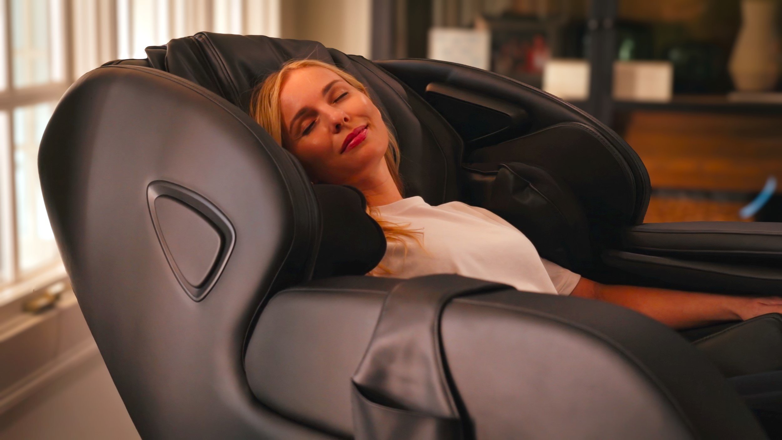 a woman relaxing in her full body massage chair