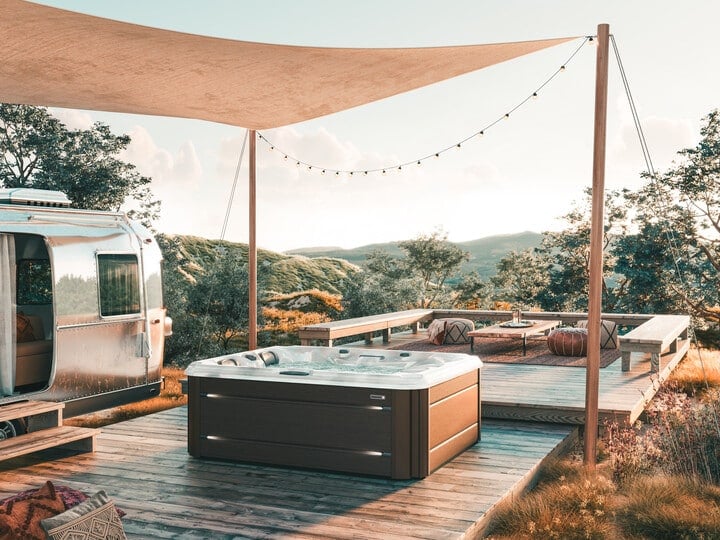 sundance spas hot tub installation with canopy and string lights